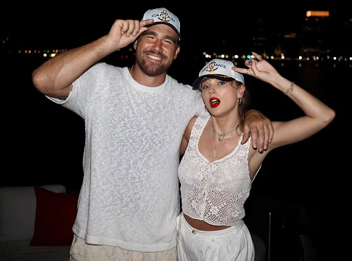 Travis Kelce reacts to Taylor Swift's provocative "Wood" song, discussing lyrics with brother Jason Kelce on New Heights podcast.