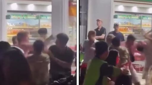 A group of tourists filmed in mass brawl outside supermarket in Bali with crowds watching the fight.