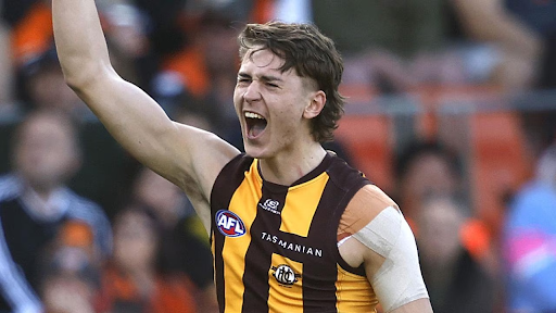 Hawthorn midfielder Will Day clutching his right shoulder during a 2026 AFL pre-season training session at Dingley.