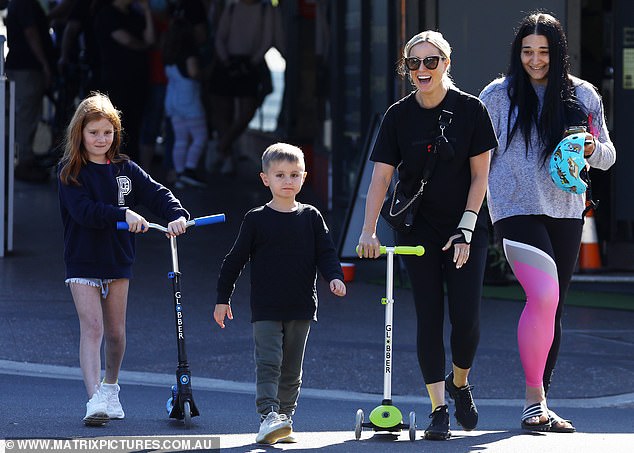Roxy Jacenko and her son Hunter posing with a new e-bike amidst social media controversy and parenting debate.