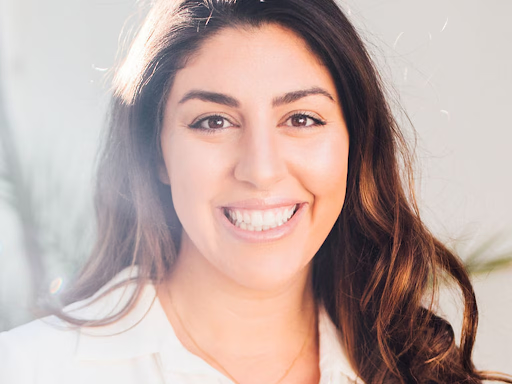 A group of hooded teenagers standing on a dimly lit street corner in Maroubra, Sydney, looking menacing.