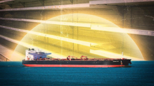 Australian and Singaporean flags waving in front of a modern fuel refinery under a blue sky during an energy crisis.