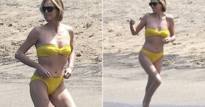 A-list actress 50 stuns in bikini on holiday while relaxing on a white sand beach in the Bahamas.