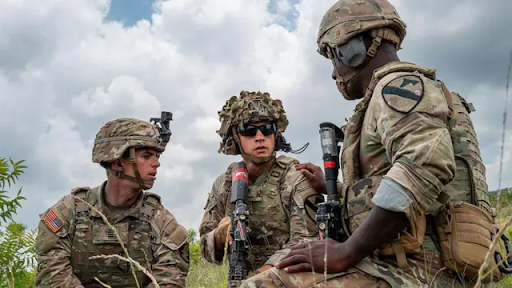 A young man looking at a digital notification on his smartphone about Selective Service registration.