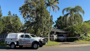 Forensic police investigators outside a Carrara home following a violent Queensland home invasion.