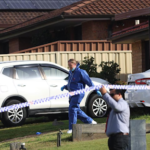 Police tape outside a suburban Sydney home in Rosemeadow after an alleged triple family murder.