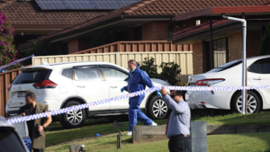 Police tape outside a suburban Sydney home in Rosemeadow after an alleged triple family murder.