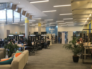 The iconic Fishburners Sydney coworking space entrance with entrepreneurs working in the background.