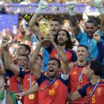 Ferran Torres celebrating passionately after scoring Spain's winning goal in the 2026 World Cup final.
