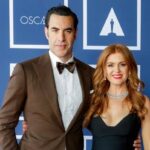 Isla Fisher and Sacha Baron Cohen posing together on the red carpet before finalizing their high-profile divorce.